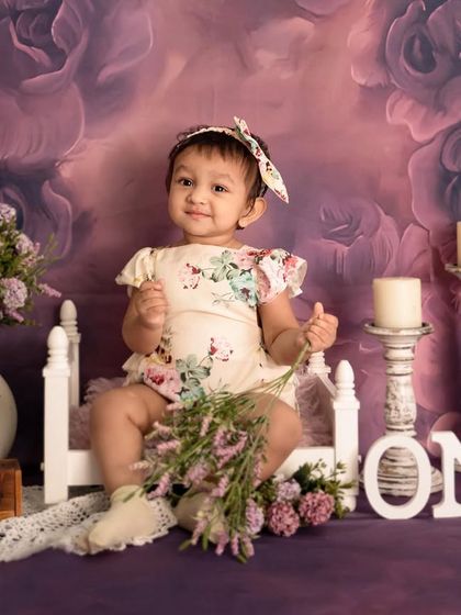 A beautiful full-length portrait from the "Lavender Dreams" session, showcasing the entire setup with floral details and vintage-style props.