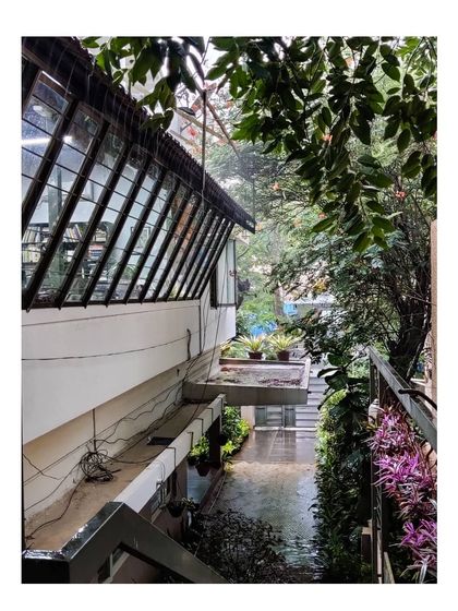 A view of our office in Bangalore on a rainy day. The space is surrounded by greenery, reflecting our philosophy of integrating nature into the built environment, even in our own workspace.