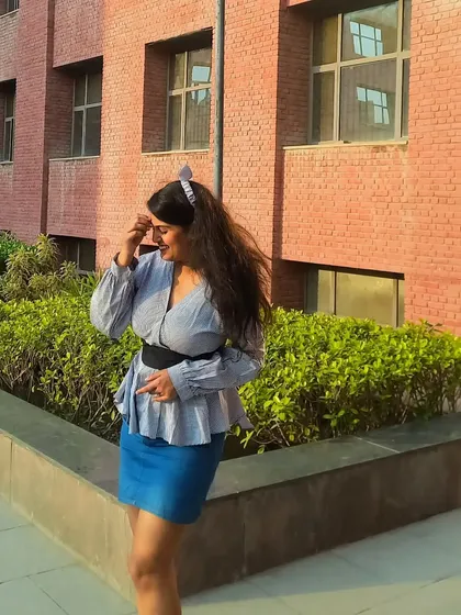 A monochrome blue look for a day at college. I styled a striped peplum top with a denim mini skirt and a wide black belt to cinch the waist and create a flattering shape.