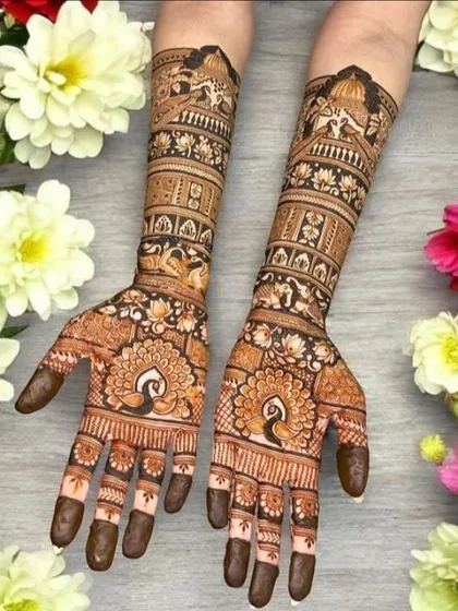A classic full-hand bridal design featuring royal peacocks and palace-inspired architecture. This style is perfect for brides who love traditional Marwadi and Rajasthani art with full coverage and intricate details.
