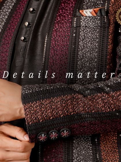 Details matter. A close-up of a striped Indo-Western jacket, showcasing the texture, sequin work, and custom buttons.