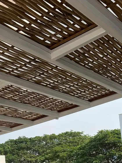 Another look at the woven bamboo ceiling. The natural material and intricate pattern create a stunning visual effect, especially with the modern black light fixtures we installed.