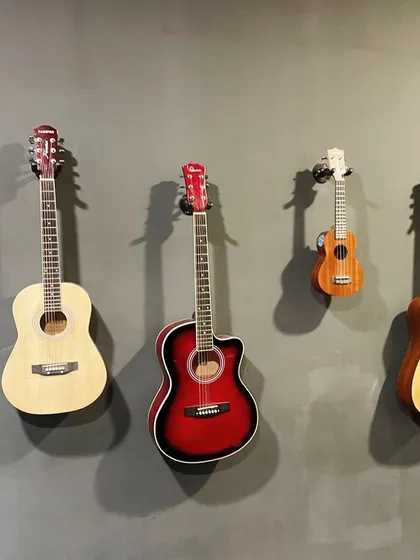 From the classic acoustic to the bright-sounding ukulele, we have a range of instruments ready for our students. This wall of guitars at our studio inspires students to pick one up and start their journey.