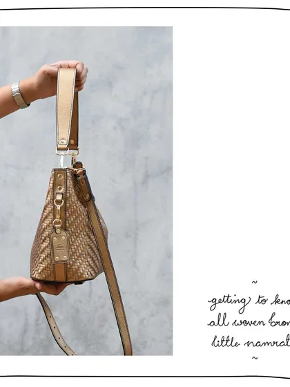 A side view of the All Woven Bronze Little Namrata, highlighting the detachable and adjustable straps.