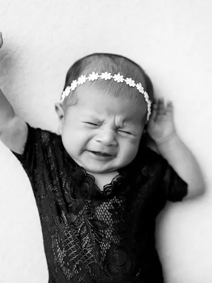 Even a crying face can make for a powerful and expressive portrait. This monochrome image captures the raw emotion of a newborn.