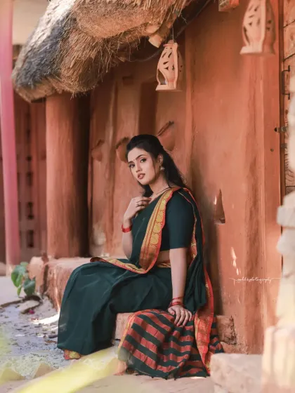 A series of portraits in a rustic, village-like setting. The model's simple green saree and relaxed poses create a feeling of serene, timeless emotion.