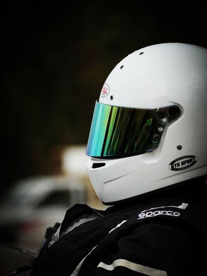 A close up of a driver's helmet.