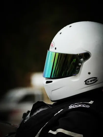 A close-up of a driver's helmet.