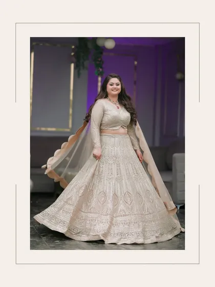 A full-length portrait of Ishita, her twirling motion frozen to display the beautiful flare of her engagement lehenga.