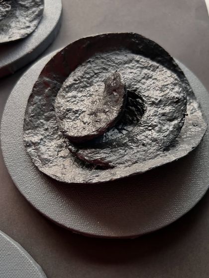 This piece from the "Order" series has a delicate, layered quality, like the petals of a flower unfolding.