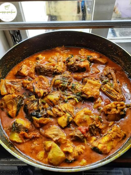 A pan of my classic fish curry, ready to be packed for delivery.