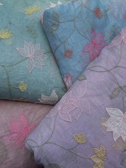 This image displays the range of pastel colors available in my lotus-embroidered Malai Chanderi. The soft blues and purples are perfect for creating serene and sophisticated ethnic wear.