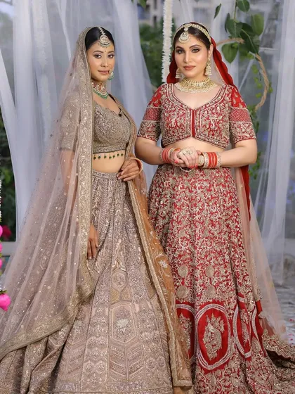 Two of my beautiful brides together, one in a classic red and the other in a soft pastel. This shows my versatility in creating distinct looks for different personalities and preferences.