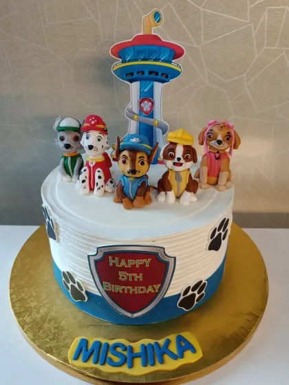 "No job is too big, no pup is too small!" This Paw Patrol cake features the whole team of fondant pups ready for action on top of a delicious cake.