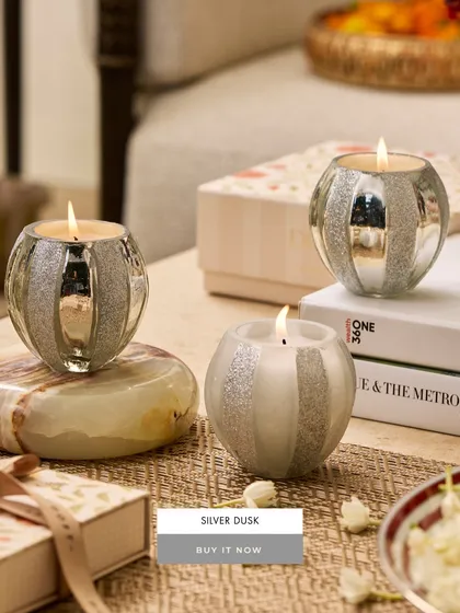 My Silver Dusk votives are like little orbs of light. The frosted and mirrored silver stripes on the round glass create a magical effect when the candle is lit, making them a perfect accent for a modern festive setting.