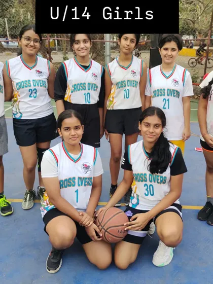Here is our U-14 girls team, ready for practice. They are focused on developing their skills in passing, shooting, and teamwork.