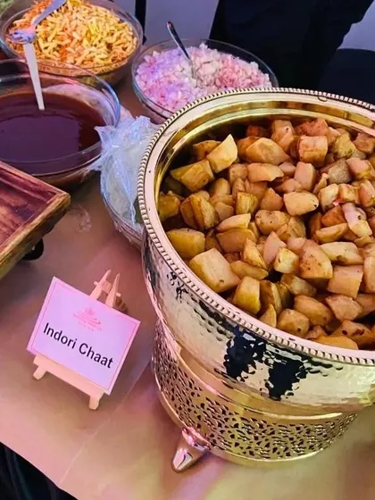 Our Indori Chaat counter is a crowd favorite at corporate events. This setup features crispy fried potatoes ready to be mixed with an assortment of chutneys, onions, and sev for a tangy and savory snack.