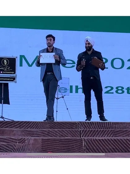 On stage with a volunteer during a corporate meet for Castrol Oil in Delhi. I often bring audience members on stage for a more personal and amazing experience.