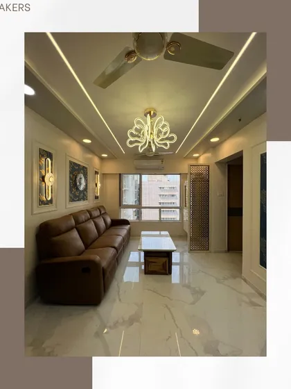 This view from a Vikhroli project shows how statement lighting and a sleek, modern sofa can define a living area.