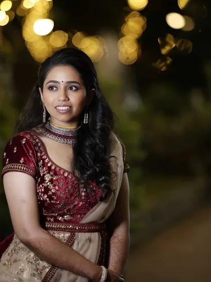 A candid shot of Varsha at her reception. The makeup was designed to look beautiful both in person and in photographs, with a focus on glowing skin.