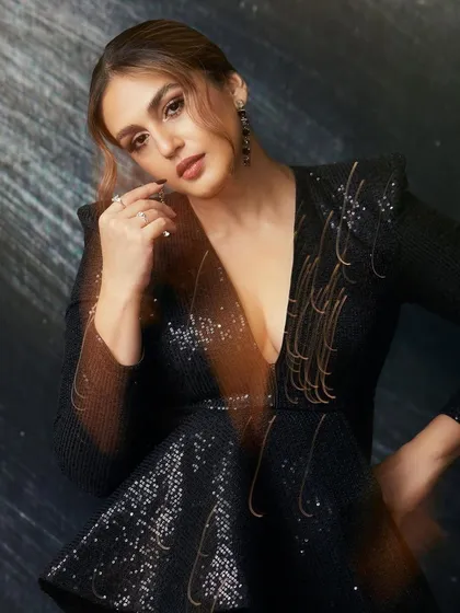A close-up of the black sequined dress, capturing the light and showing off the intricate details.