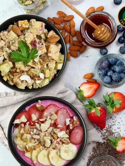 A beautiful shot of my Chicken Waldorf Salad next to a vibrant smoothie bowl. I offer a wide range of healthy options to satisfy any craving.