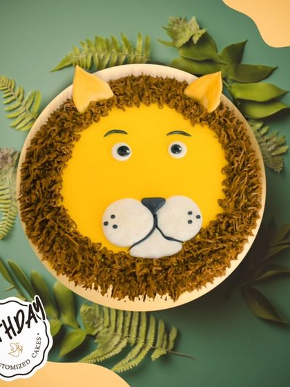A roaringly cute lion face cake. The piped buttercream mane gives this cake a fun texture, perfect for the little king of the jungle.