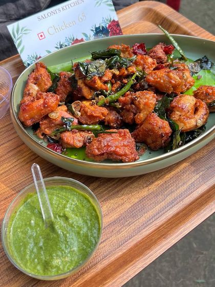 Spicy and flavorful Chicken 65 served with green chutney, a classic starter that's always a hit.