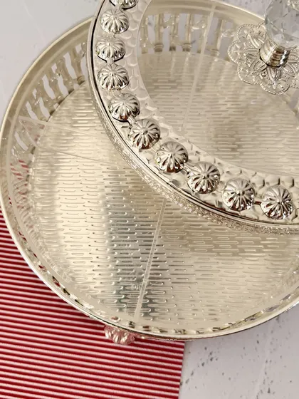 A top-down view highlighting the textured base and floral-engraved rim of the lid. Every detail is crafted to create a sense of luxury.