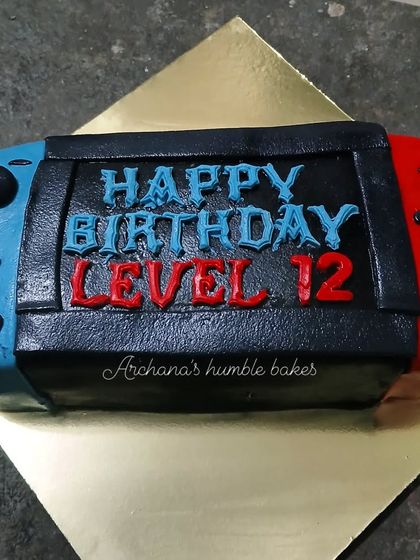 A cake designed to look exactly like a Nintendo Switch console, perfect for a 12th birthday.