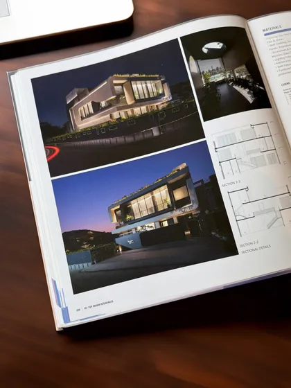The publication includes detailed photographs and architectural drawings of Residence 100, showcasing its design from multiple perspectives.
