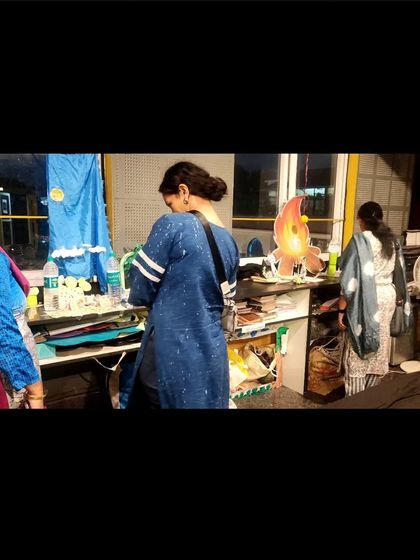 Another view of the parents' viewing, showing their engagement with their children's creative work.