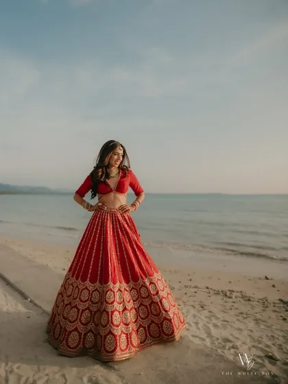 There's nothing like a destination wedding. For this beautiful bride's beach ceremony in Thailand, we went with soft, flowing waves that moved with the sea breeze. It was the perfect complement to her stunning red Sabyasachi lehenga.