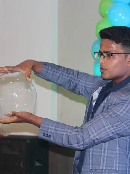 I love adding a touch of magic to my bubble act. This photo shows me creating a smoke-filled bubble, a trick that always gets a gasp from the audience and adds a cool, mysterious element to the show.