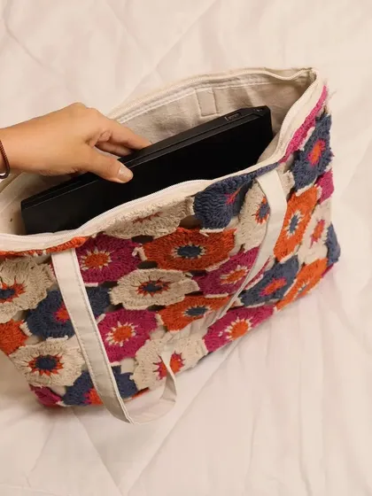 Many customers ask if this tote can hold a laptop, and the answer is yes. Here you can see how easily a standard laptop fits inside, with a secure zip closure to keep everything safe. It’s a stylish and practical handmade laptop bag.