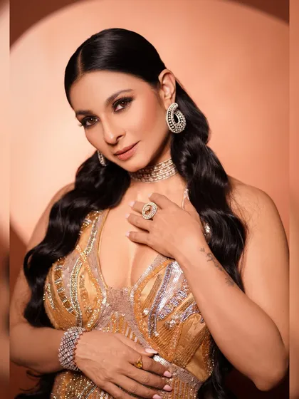 A confident and alluring portrait. Tanishaa's pose and expression perfectly match the high-glamour theme of this sequined gown and diamond jewelry.