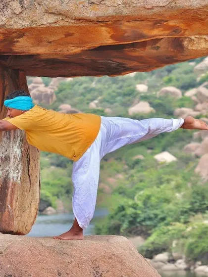 Aligning my body with the ancient, weathered rocks of Hampi. Yoga alignment is not about creating a perfect shape, but about finding a stable structure from which you can experience a deeper connection to your surroundings.