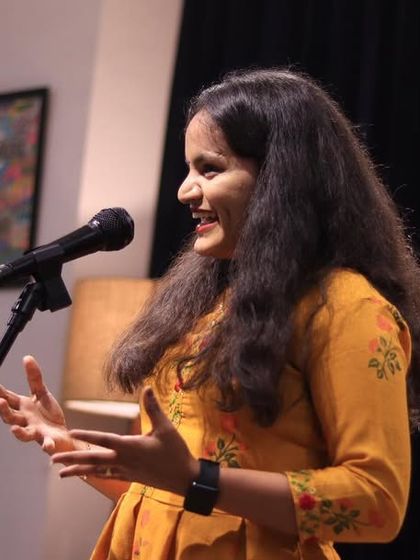 A young performer shares her story with a smile.