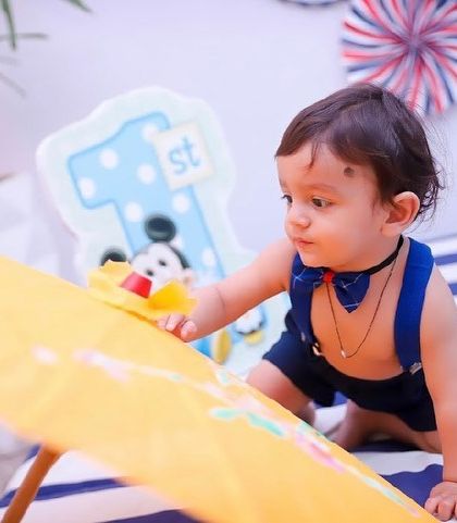 Exploring his birthday setup. We create a playful environment where your child can feel comfortable and be themselves.