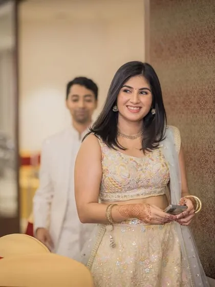 A candid shot of the bride-to-be as she walks through the event hall.