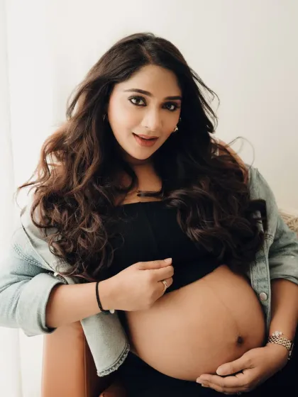 A beautiful close up showing off the baby bump. This casual and intimate shot captures the excitement and beauty of pregnancy in a very real and down to earth way.