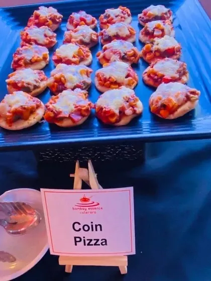 Bite-sized Coin Pizzas served as appetizers at a channel partner meet for JP Infra. These are a perfect mess-free finger food option for professional networking events.