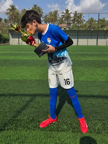 A kiss for the trophy from one of our victorious U14 players.
