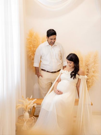 Another angle from this beautiful bohemian-themed couple shoot, showing the full setup with the wooden bench and soft lighting.