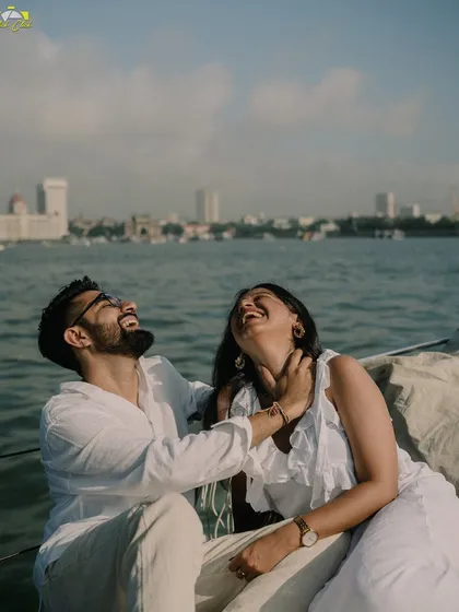 Pure, uninhibited laughter on a yacht against the Mumbai skyline. These are the moments that truly define a relationship.
