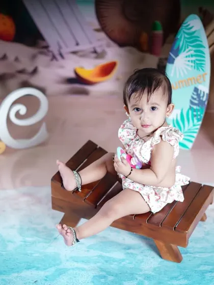 An overhead shot of the little girl on her beach lounge chair, showing off the fun details of the set.
