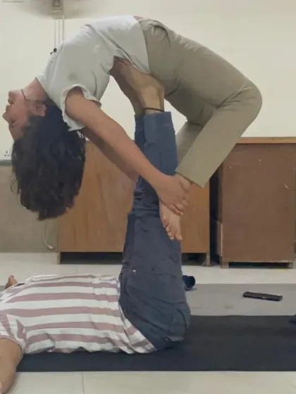 This image captures the trust between the base (me) and the flyer during an Acro Yoga backbend. It's a practice that strengthens both the body and interpersonal connections.