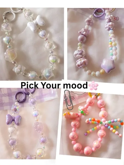 Pick your mood from this collection of kawaii bag charms. Whether you love the iridescent white bow charm, the purple teddy and star charm, or the bright pink candy bead charm, there's a style for every vibe.