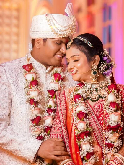 A romantic close-up of the bride and groom. Her makeup is soft and radiant, with captivating eyes and a beautiful glow that enhances the intimacy of the moment.