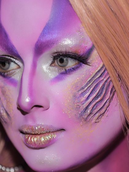 The fine details of an SFX and face painting class project. Notice the delicate line work and use of glitter to add texture and dimension.